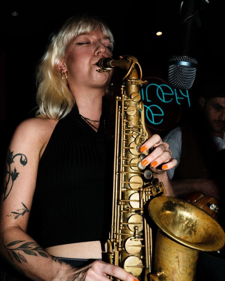 Jemima Whyte playing tenor saxophone